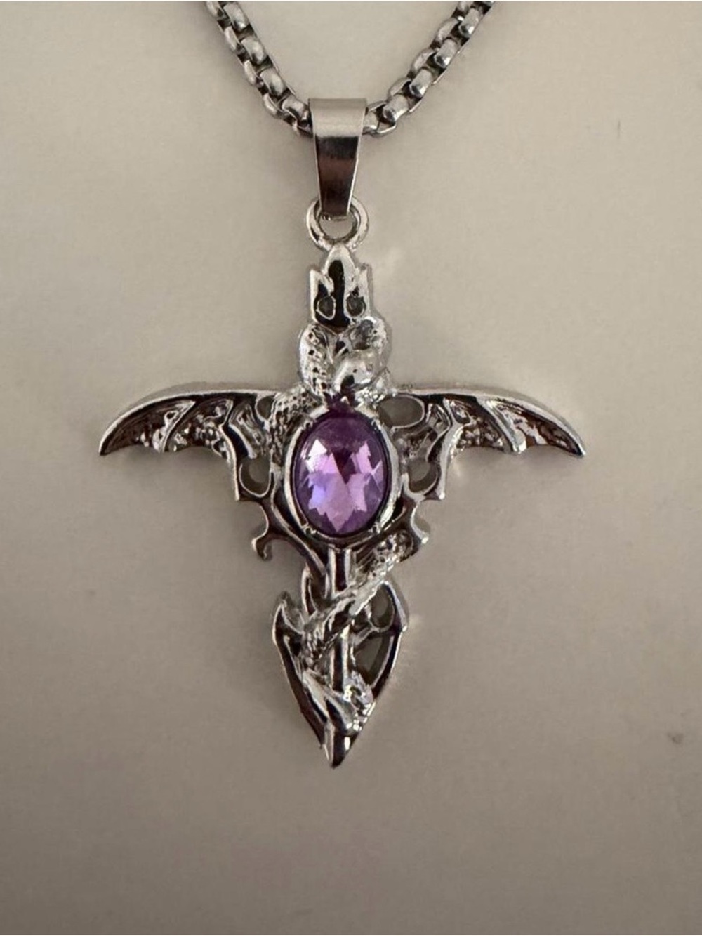 Silver Wing Pendant Necklace with Purple Gem